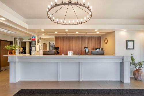 a lobby with a large white counter in a hospital at SureStay Plus by Best Western Enterprise in Enterprise