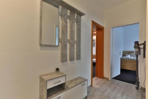 Postel nebo postele na pokoji v ubytování Moderne Ferienwohnungen - Service wie im Hotel