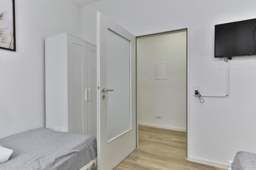 Postel nebo postele na pokoji v ubytování Moderne Ferienwohnungen - Service wie im Hotel