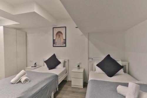 Postel nebo postele na pokoji v ubytování Moderne Ferienwohnungen - Service wie im Hotel