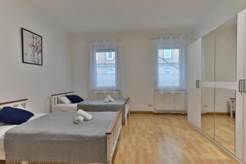 Ένα ή περισσότερα κρεβάτια σε δωμάτιο στο Studio Suite mit Service wie im Hotel