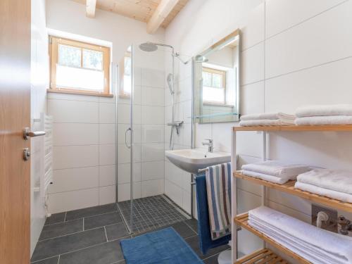 a bathroom with a shower and a sink at Apart Heidi in Donnersbachwald
