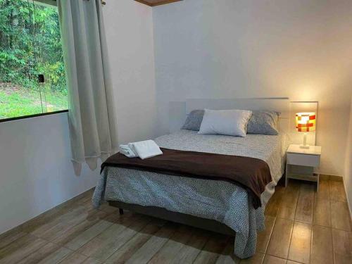 En eller flere senge i et værelse på Casa Mia seu momento na Serra