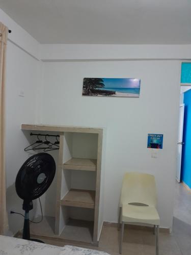 A television and/or entertainment centre at Brisas del Mar Apto 1B