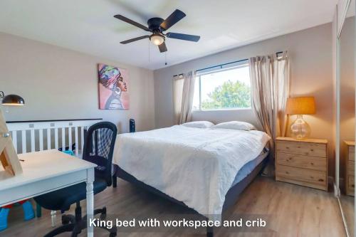 a bedroom with a bed with a desk and a window at Entire Private 3-Bedroom Townhouse with King Bed near Bay & Beach, No Deposit in Chula Vista