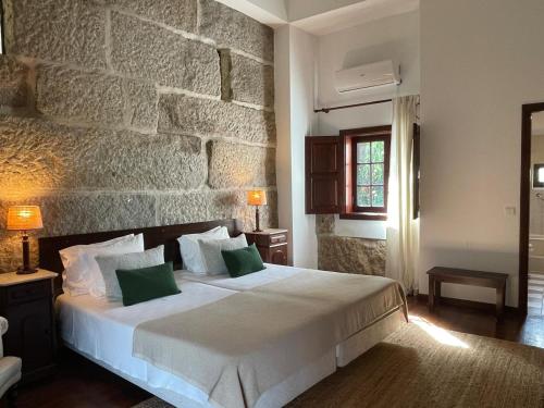 Ένα ή περισσότερα κρεβάτια σε δωμάτιο στο casa dos esteios