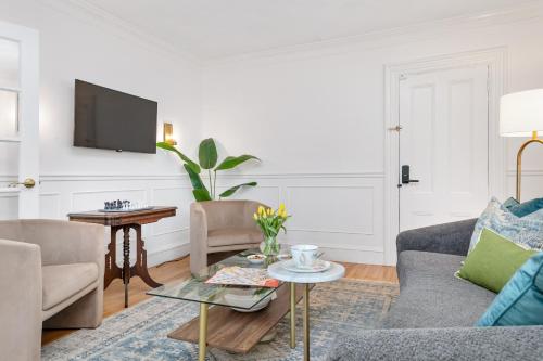 a living room with a couch and a table at The Front Porch Vacation Rentals in Bristol