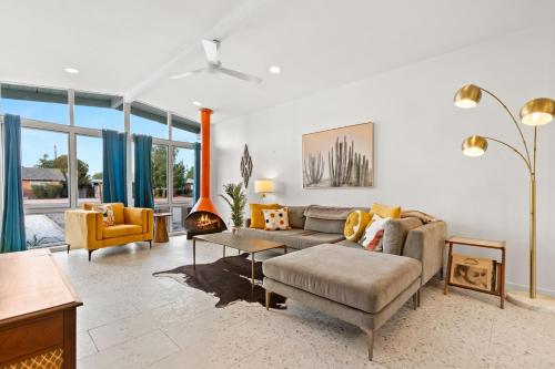 a living room with a couch and a table at Desert Dream - Old Town Mid-Century Modern - Heated Pool in Scottsdale