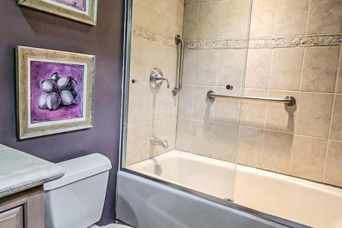 a bathroom with a shower and a tub and a toilet at Pacifico Townhouse 106 in Coco