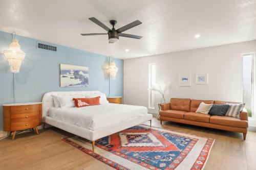 a living room with a bed and a couch at Olive Tree Retreat - Heated Pool, Patio & Privacy in Scottsdale