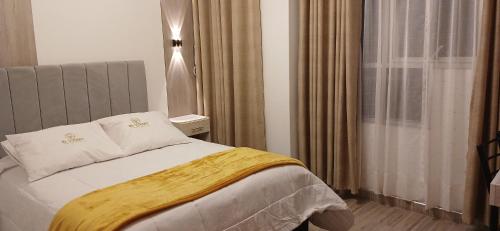 Postel nebo postele na pokoji v ubytování Hotel El Virrey Suite