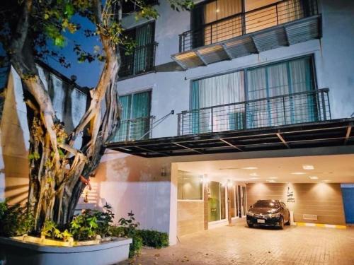 a car parked in the courtyard of a building at ViVi Avenue Thonglor in Bangkok