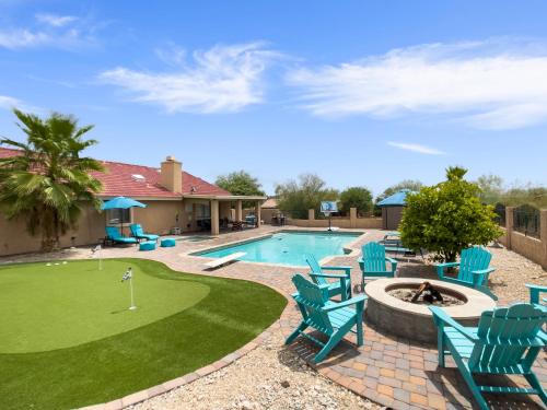 a swimming pool with chairs and a putting green at Glenbrook - Free Heated Pool - Hot Tub - Fire Pit in Fountain Hills