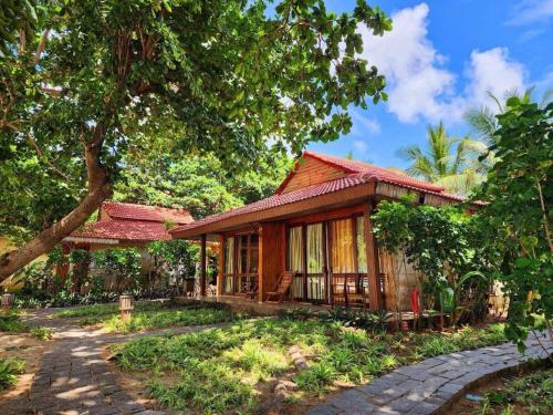 a small house in the middle of a forest at Tan Son Nhat Con Dao Resort in Con Dao