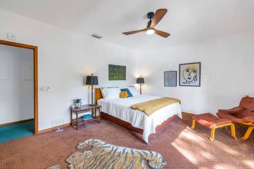 a bedroom with a bed and a ceiling fan at Rainbow River Estate on Blue Run in Dunnellon