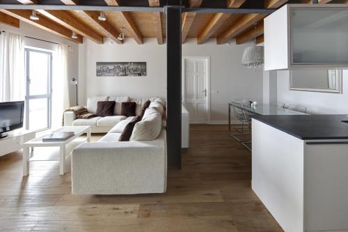 a living room with a couch and a table at Val Arties 3 by FeelFree Rentals in Arties