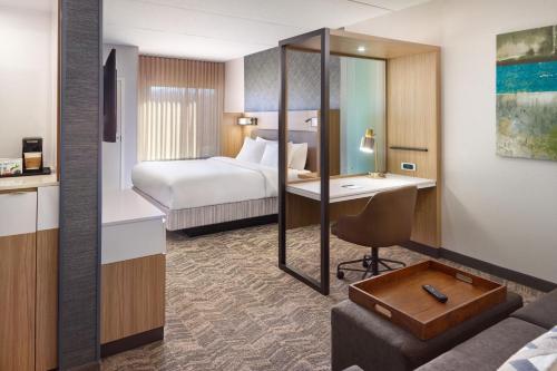a hotel room with a bed and a desk at SpringHill Suites by Marriott Arlington TN in Arlington