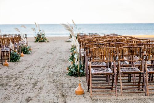 a row of chairs sitting on the beach at Marriott Virginia Beach Oceanfront Resort in Virginia Beach