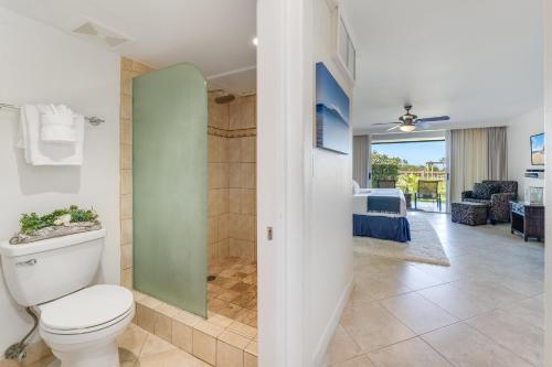 a bathroom with a toilet and a walk in shower at Eldorado K103 in Kahana