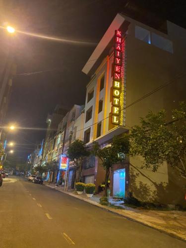a hotel sign on the side of a street at night at Khách Sạn Khải Yến in Pleiku
