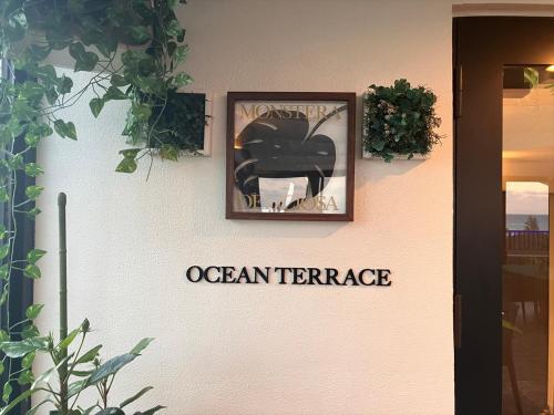 a sign on the door of an entrance to an apartment at The Peridot Smart Hotel Tancha Ward in Onna