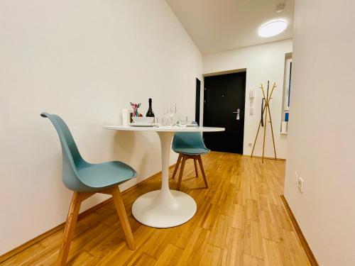 a table and two chairs in a room at APSTAY City Center I FREE Parking I Self Check-in in Graz
