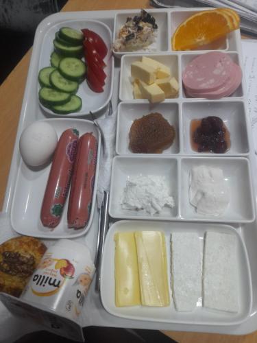 a lunch box filled with cheese and other food items at CTH-Baku-Hostel in Baku