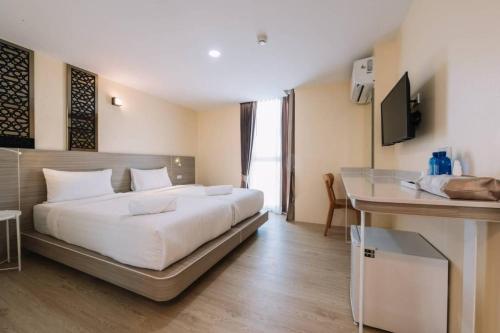 Postel nebo postele na pokoji v ubytování วัน บัดเจท เชียงราย พหลโยธิน One Budget Hotel Chiangrai Phahonyothin
