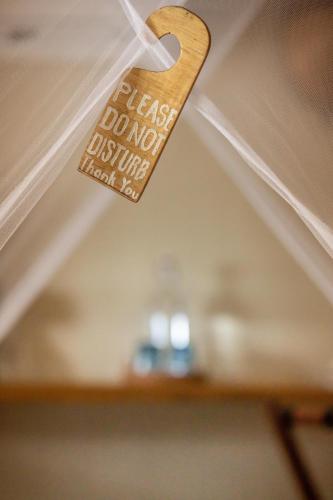 a heart shaped sign hanging from a ceiling at The Beach House Ocam Ocam in Busuanga
