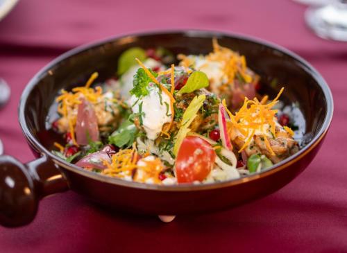 a bowl of food sitting on a table at Delta Nature Resort in Tulcea