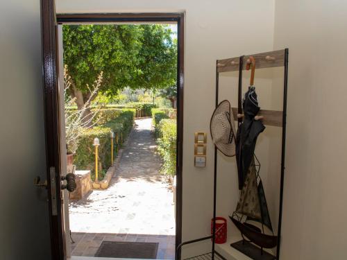an open door with a view of a pathway at Aphrodite View in Korakiaí