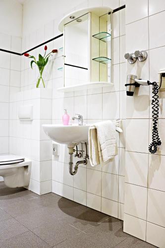 a bathroom with a sink and a toilet at Air in Berlin in Berlin