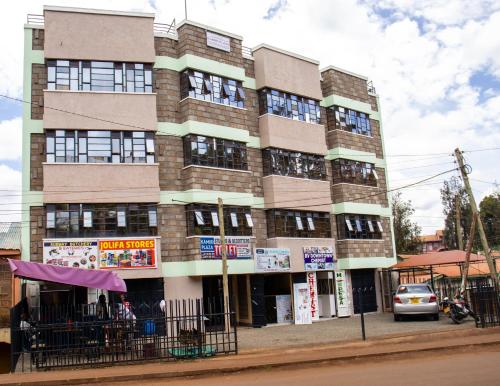 a building on the corner of a street at Ultimate Elegance in Embu