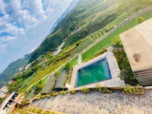 a house on a hill with a swimming pool at Sapa J&K Homestay and Swimming Pool in Sa Pa