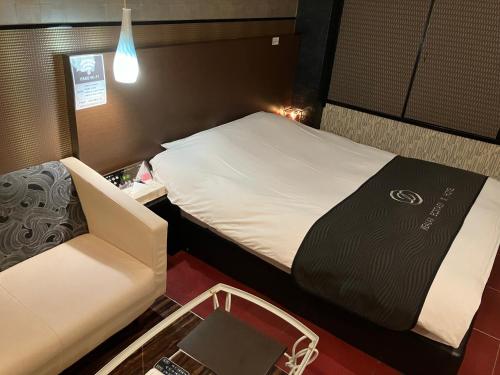Postel nebo postele na pokoji v ubytování X Hotel - Adult Only-