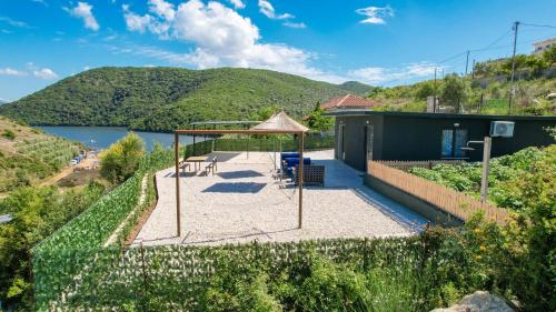 a view of a house with a gazebo at Lago Calmo Villa in Ksamil