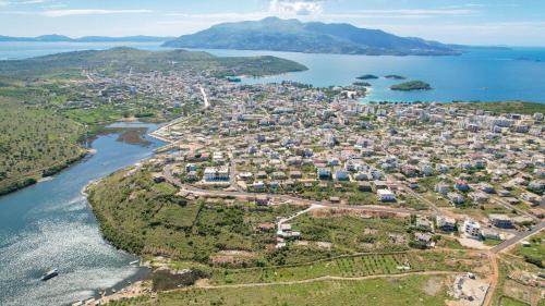 an aerial view of a city next to a body of water at Lago Calmo Villa in Ksamil