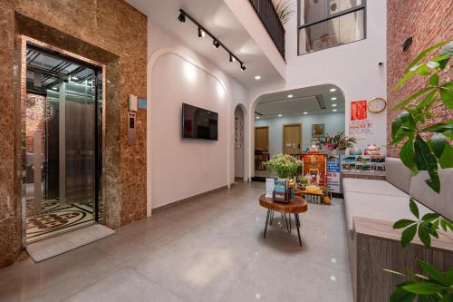 a lobby of a store with a table in it at LASANTA Villa in Hoi An