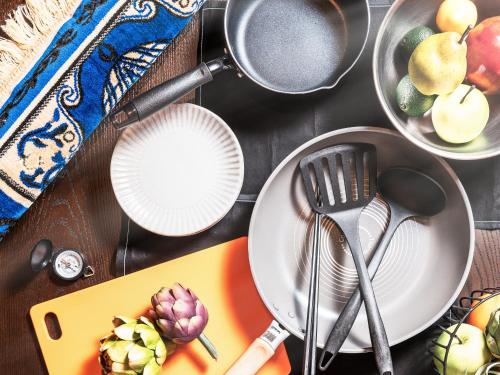 a table with plates and utensils and bowls of food at MIMARU Tokyo Ueno North in Tokyo