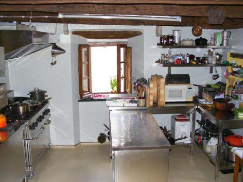 a kitchen with a counter and a window at Casa Marchi in Bagni di Lucca
