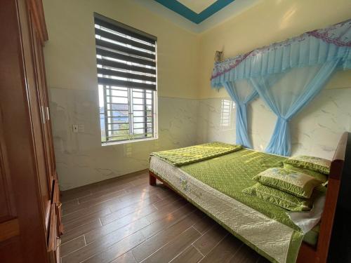 Ένα ή περισσότερα κρεβάτια σε δωμάτιο στο Homestay Sea View Ông Hoành