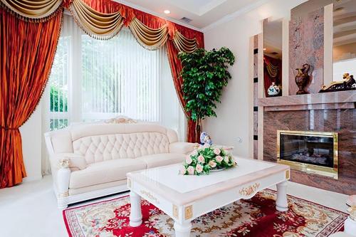 a living room with a white couch and a fireplace at Harmony House in Richmond