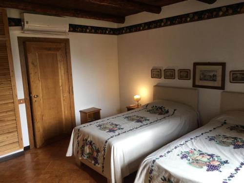 a bedroom with two beds in a room at Colle Rampo in Colleferro