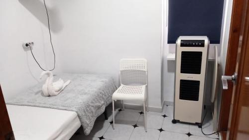 a hospital room with a bed and a machine at Guests House River in Málaga