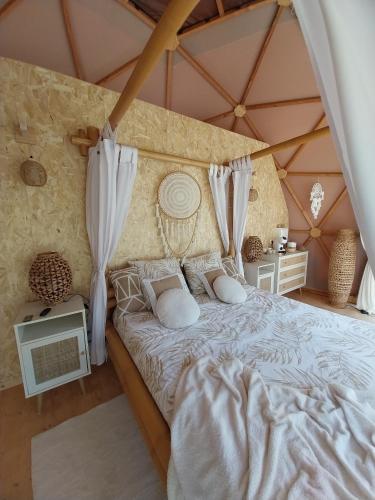 a bedroom with a bed in a tent at Le Clos FMR Insolite - "F"anny Carcassonne in Malves-en-Minervois