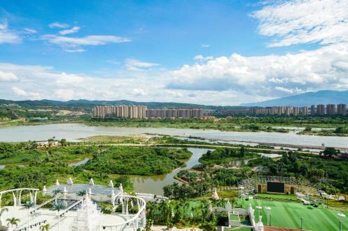 an aerial view of a river and a city at Mekong River Jing Land Hotel in Jinghong