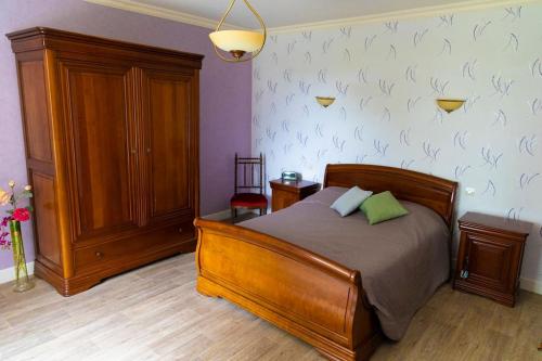 Ένα ή περισσότερα κρεβάτια σε δωμάτιο στο La Charmille - Grande maison bourgeoise, 35 Kms du Futuroscope