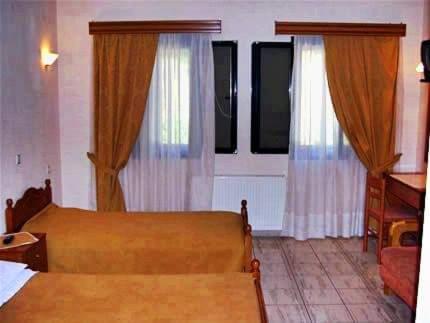 Postel nebo postele na pokoji v ubytování Guesthouse Bizani