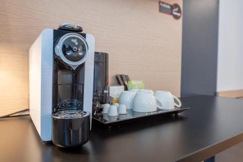 Hotel Roc Melerにあるコーヒーまたはお茶