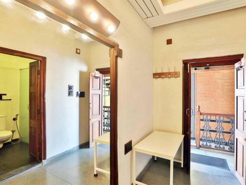 a room with a door and a bench in it at Mangaldas Ni Haveli II by The House of MG in Ahmedabad